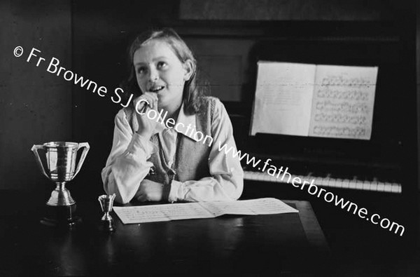 JONES FAMILY AT 7 AILESBURY ROAD BETTY STUDYING MUSIC